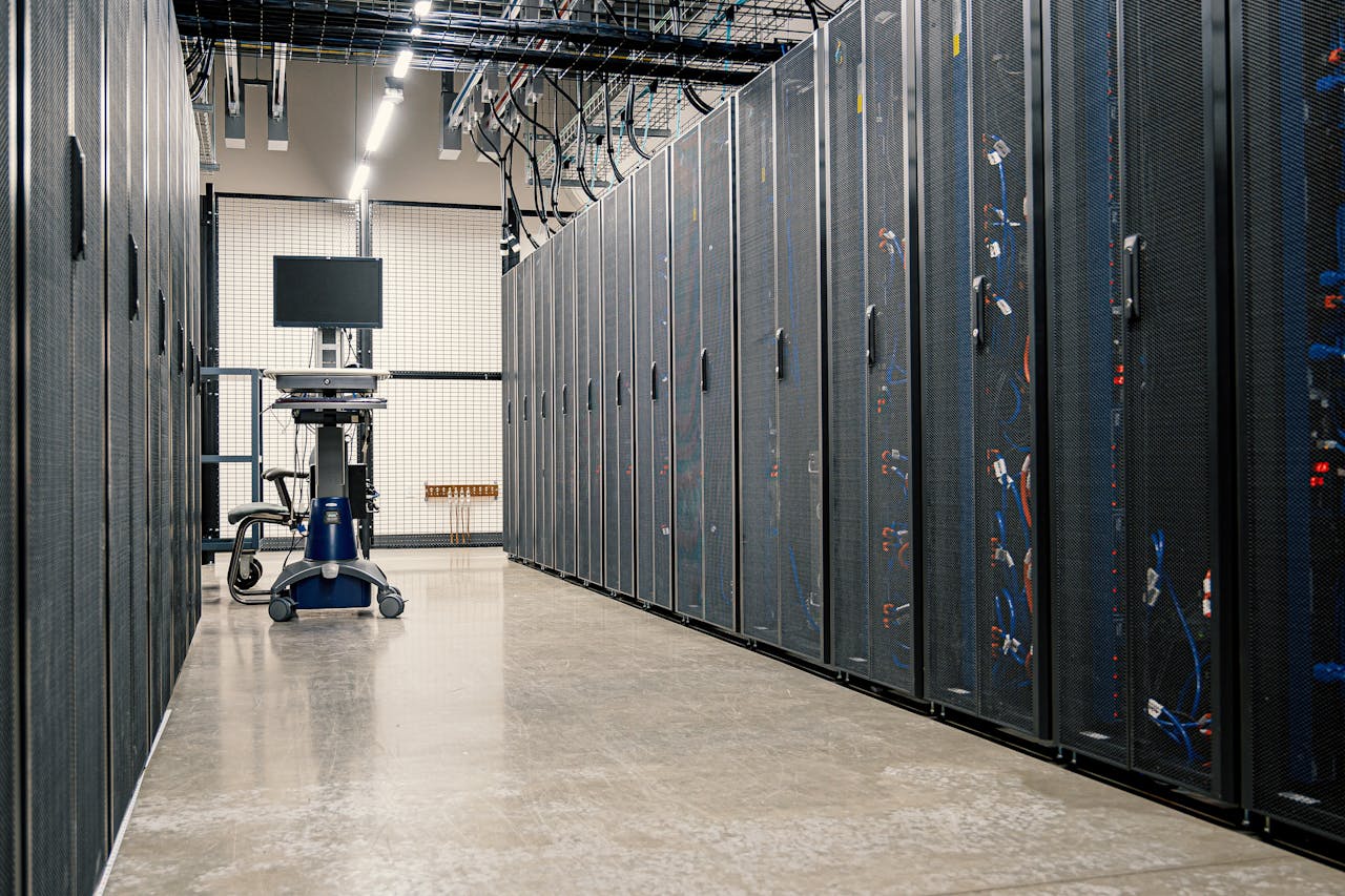 Steel framework cabinets housing servers networking devices and cables in contemporary equipped data center